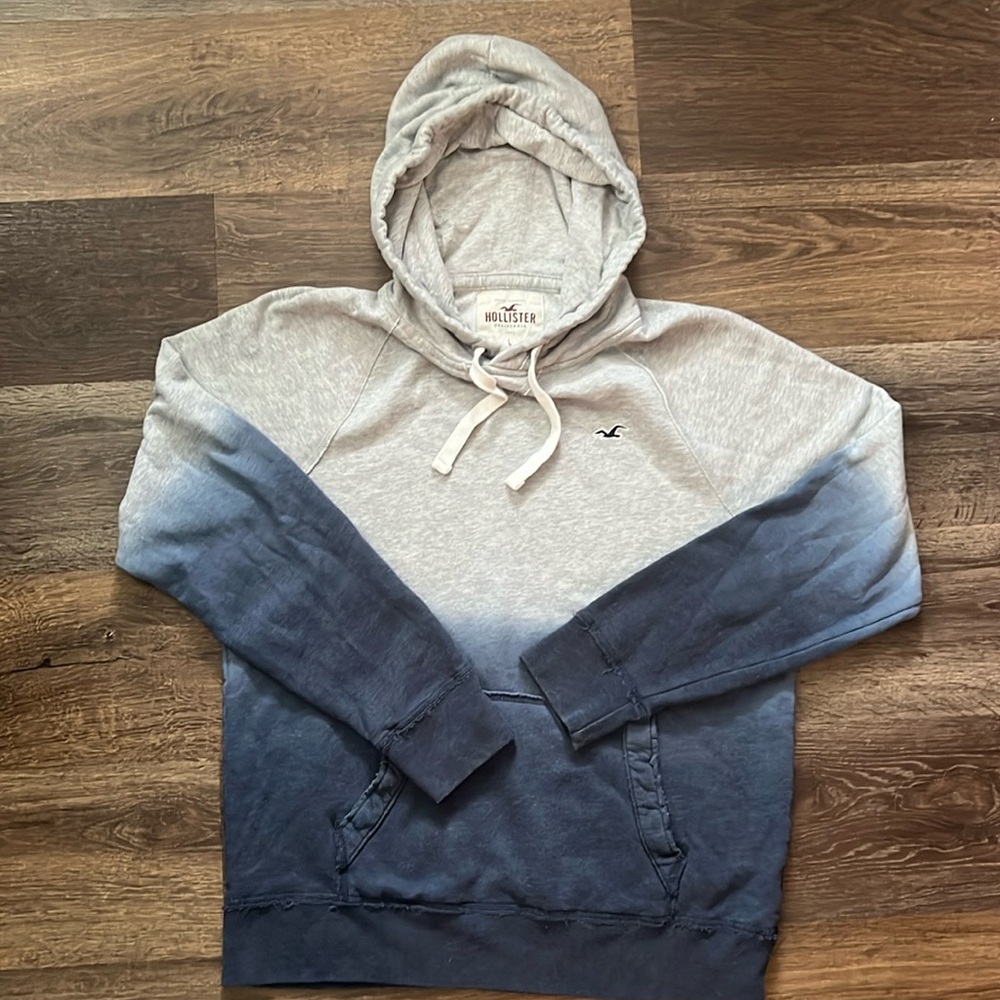 Hollister grey faded to blue hoodie- practically like new , maybe worn once.